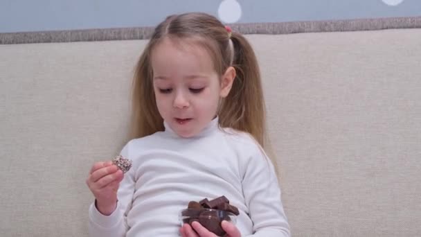 Happy Little Girl Enjoying Eat Glass Bowl Chocolates Sweet Snack — Stok video
