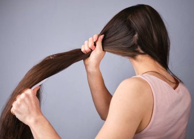 Cute, young woman brush comb hairstyle long morning beauty routine Hair Care Beauty Concept. High quality photo