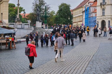 Tourists at Prague Old Town Square, large group of people gathered at the street. High quality photo