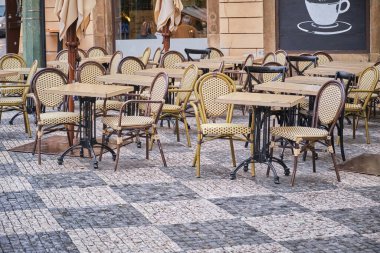 Outdoor empty coffee and restaurant terrace with tables and chairs. High quality photo
