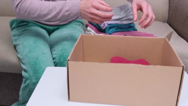 Clothes Donation Packing Cardboard Box Top View Packing Second Hand — ストック動画
