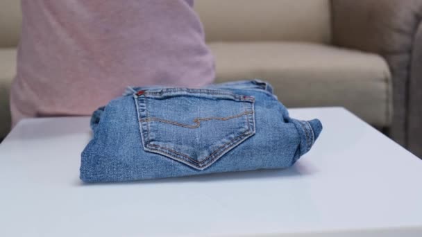 Woman Hands Folding Jeans Pants Clothes Putting Together Order Concept — 图库视频影像