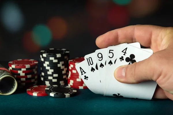 Poker cards with high card combination in the player hand. Lucky combination in a game in a poker club. Fortune in a poker game.