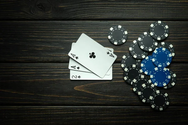 Bad combination of cards in a poker game. Lose or go bankrupt in a card game. Place for advertising on a black background.