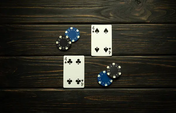 stock image A successful poker game layout on a vintage club table with one pair and chips.