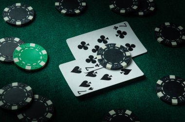 Game environment on the table in a poker club with a combination of cards one pair and chips. A successful win depends on a lucky day. clipart