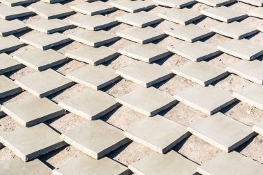 Plenty of clay tiles drying on Africa sun in pottery factory in Fez, Morocco, North Africa