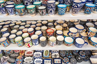 Shelves full of handmade ceramic products in pottery factory in Fez, Morocco, North Africa