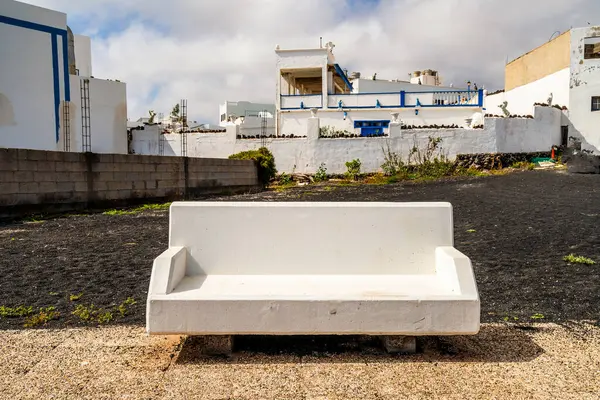 stock image White bench in the downtown of Orzola, Lanzarote, Canary Islands, Spain