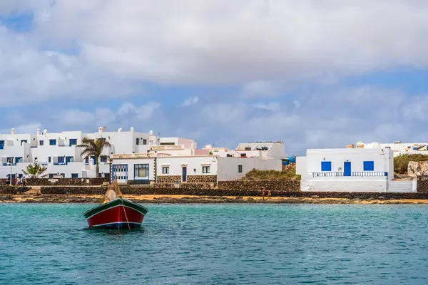 stock image Beautiful coast of La Graciosa island with the boat in the foreground, Caleta del Sebo, one of Canary Islands, Spain