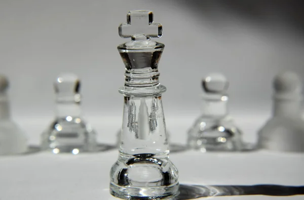 King - Glass Chess Pieces in Formation - Closeup, Light and Shadow