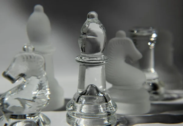 Bishop Glass Chess Pieces in Formation - Closeup, Light and Shadow