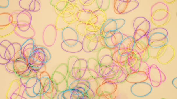 Hands Taking Bunch Colorful Rubber Bands Them One One Yellow — Vídeo de stock