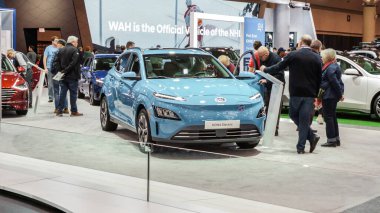 Crowds looking at new car models at Auto show. Hyundai Kona electric car on display. National Canadian Auto Show with many car brands. Toronto ON Canada Feb 19, 2023