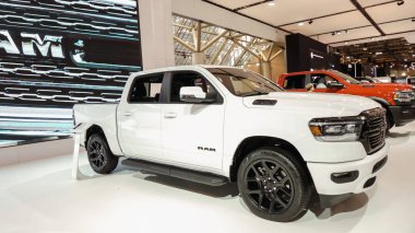 Crowds looking at new car models at Auto show. RAM truck on display. National Canadian Auto Show with many car brands. Toronto ON Canada Feb 19, 2023