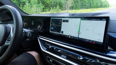 Toronto ON, Canada - June 29, 2025: BMW X5 dashboard showcases a high-tech display with navigation features and ample copy space for creative design applications