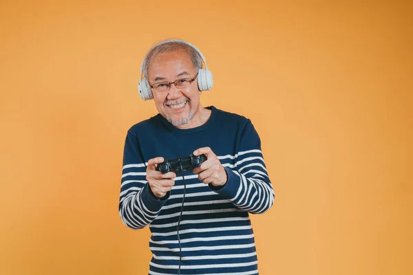 stock image Asian Senior older man family having fun enjoying play video game funny video. Happiness lifestyle on retirement concepts.