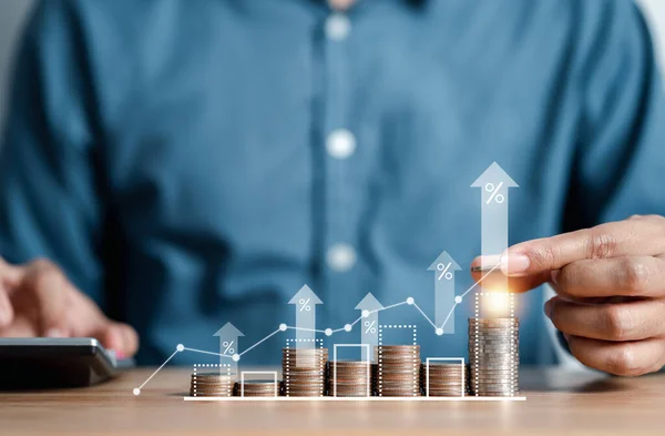 stock image Businessman stacking money coins accounting for increase financial interest rate and business investment growth from dividend, Business Finance and Money, Save money for prepare in the future.