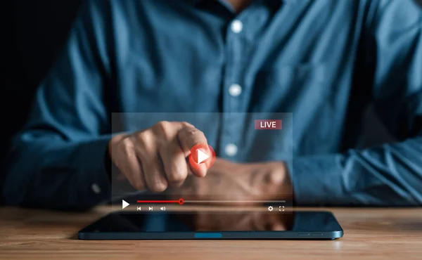 Man touching smartphone to starting live streaming and watching screen for video streaming on internet and multimedia, social technology, social Media, lifestyle with technology.