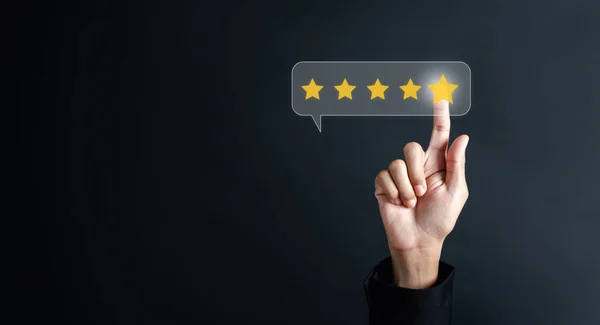 Hand giving five star customer satisfaction feedback review concept.Customer service experience and business satisfaction