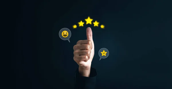 Customer satisfaction feedback review concept. Hand with thumb up Positive emotion happy smile face and five star with copy space. Customer service experience and business satisfaction