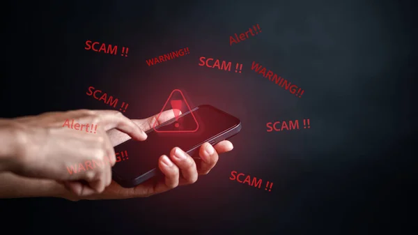 Scam alert on notification smartphone concept, virus hacker internet security, Businessman holding smart phone. Scam money from banking apps, Spam Email Pop-up Warning.