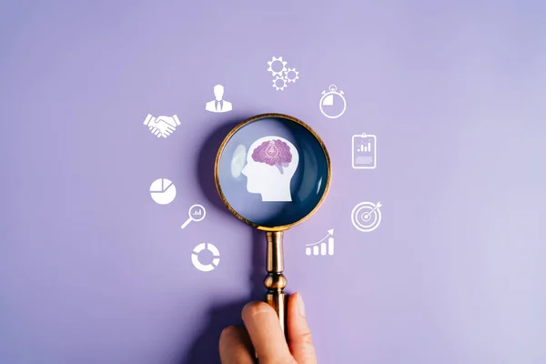 Magnifying glass focus to human brain with light bulb icon which for mind, creative, idea, innovation, motivation planning development leadership and customer target group concept.