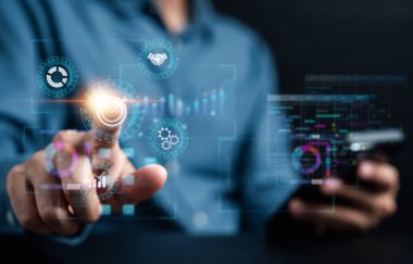 Analyst working with computer in Business Analytics and Data Management System to make report with KPI and metrics connected to database. Corporate strategy for finance, operations, sales, marketing.