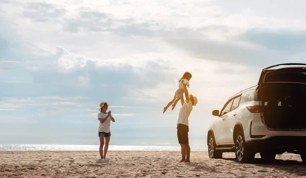 stock image Happy Family with car travel road trip. summer vacation in car in the sunset, Dad, mom and daughter happy traveling enjoy together driving in holidays, people lifestyle ride by automobile.