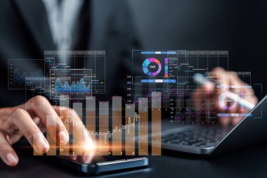 Analyst working with computer in Business Analytics and Data Management System to make report with KPI and metrics connected to database. Corporate strategy for finance, operations, sales, marketing.