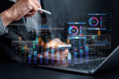 Analyst working with computer in Business Analytics and Data Management System to make report with KPI and metrics connected to database. Corporate strategy for finance, operations, sales, marketing.