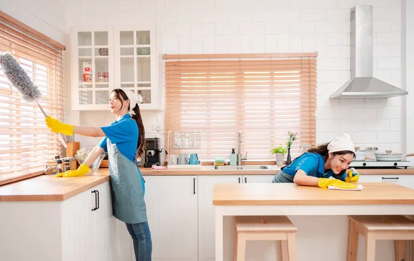 stock image Housework or house keeping service female cleaning dust in house, cleaning agency small business. professional equipment cleaning old home.