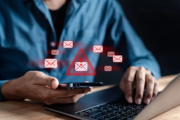 stock image Alert Email inbox and spam virus with warning caution for notification on internet letter security protect, junk and trash mail and compromised information.