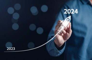 Start 2024 with rocket launch of Happy new year resolution planning and challenge strategy business with arrow up in New year 2024 and countdown merry christmas and happy new year concept.	