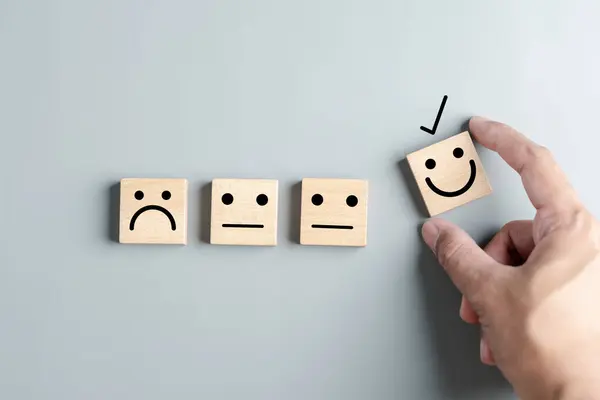 Smiley face mental health assessment positive. refresh wellness emotion, Hand selection max happiness emotion. change emotion concept.