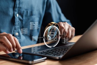 Analyst working with computer in Business Analytics and Data Management System to make report with KPI and metrics connected to database. Corporate strategy for finance, operations, sales, marketing.