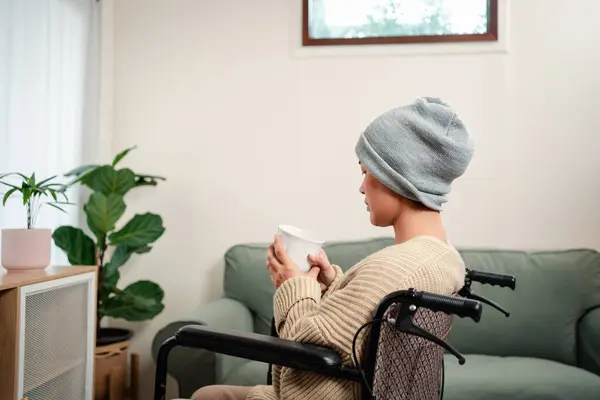 stock image Young woman have a sick with cancer her worry and stress feeling lifestyle in living room at home.