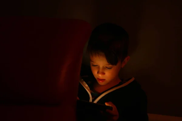 Little Boy Playing Tablet Cellphone Dark Kids Face Illuminated Light — Fotografia de Stock