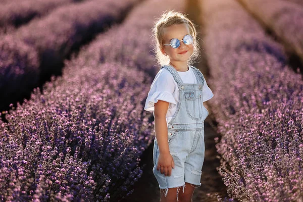 Adorable Child Girl Lavender Field Sunset Smiling Kid Sunglasses Jeans — Stockfoto