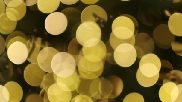 Guirlandes de bokeh dorées, fond de Noël. Les lumières rondes orange vif de bokeh scintillent. Bonne année décoration de célébration. Concept de vacances. Modèle festif. Texture floue. Ampoules électriques brillantes.