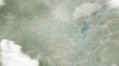 Dünya uzaydan Changde, Çin 'e yakınlaşır. Arkasından bulutlar ve atmosferden uzaya zum geliyor. Uydu görüntüsü. Seyahat girişi