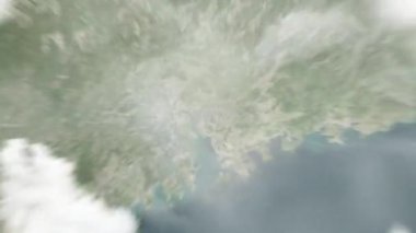 Dünya uzaydan Dongguan 'a, Çin Merkez Meydanı' na yakınlaşır. Arkasından bulutlar ve atmosferden uzaya zum geliyor. Uydu görüntüsü. Seyahat girişi