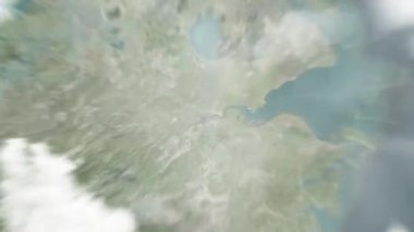 Dünya uzaydan Hangzhou, Çin 'e yakınlaşır. Arkasından bulutlar ve atmosferden uzaya zum geliyor. Uydu görüntüsü. Seyahat girişi