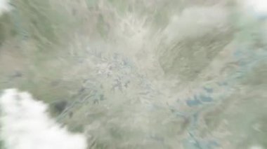 Dünya uzaydan Huanggang, Çin 'e yakınlaştırıyor. Arkasından bulutlar ve atmosferden uzaya zum geliyor. Uydu görüntüsü. Seyahat girişi