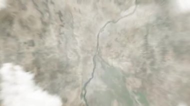 Dünya, Omdurman pazarında uzaydan Hartum, Sudan 'a yakınlaşır. Arkasından bulutlar ve atmosferden uzaya zum geliyor. Uydu görüntüsü. Seyahat girişi