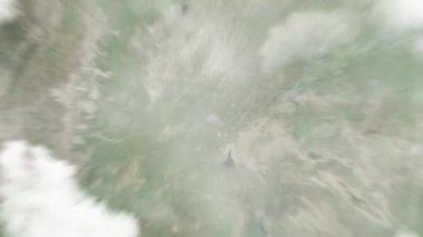 Dünya, uzaydan Guangyuelou 'daki Liaocheng, Çin' e yakınlaşır. Arkasından bulutlar ve atmosferden uzaya zum geliyor. Uydu görüntüsü. Seyahat girişi
