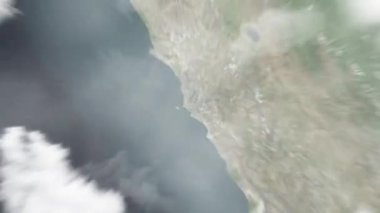Dünya uzaydan Lima 'ya, Plaza Francisco Bolognesi' deki Peru 'ya yakınlaşır. Arkasından bulutlar ve atmosferden uzaya zum geliyor. Uydu görüntüsü. Seyahat girişi