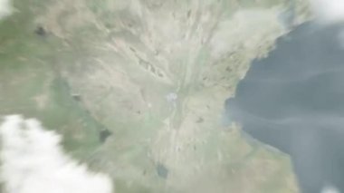 Dünya uzaydan Linyi, Çin 'e yakınlaşır. Arkasından bulutlar ve atmosferden uzaya zum geliyor. Uydu görüntüsü. Seyahat girişi
