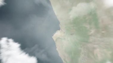 Dünya, Ulusal Meclis 'te uzaydan Luanda, Angola' ya yakınlaşacak. Arkasından bulutlar ve atmosferden uzaya zum geliyor. Uydu görüntüsü. Seyahat girişi