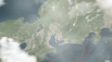 Dünya uzaydan Nagoya 'ya, Nagoya Kalesi' ndeki Japonya 'ya yakınlaşır. Arkasından bulutlar ve atmosferden uzaya zum geliyor. Uydu görüntüsü. Seyahat girişi